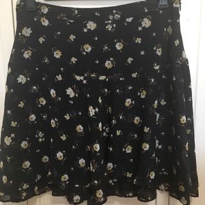 Flouncy, floral skirt with layered hem detail.